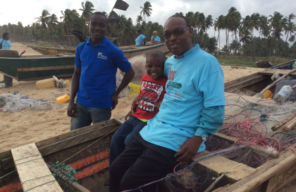 Michael-Ladele-and-young-Ola-Olu-in-a-boat